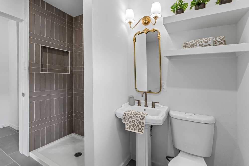 Full bath - designer tile and brass