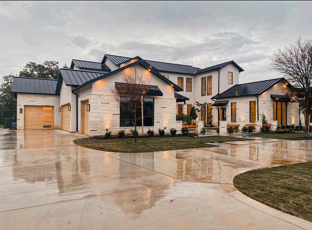 Custom build - stone and metal roof at dusk