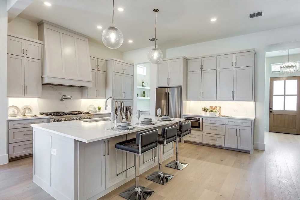 White kitchen with oversized island