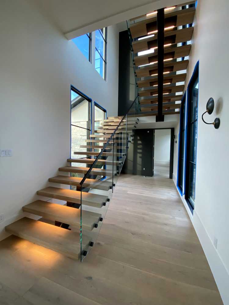 Floating staircase with accent lighting